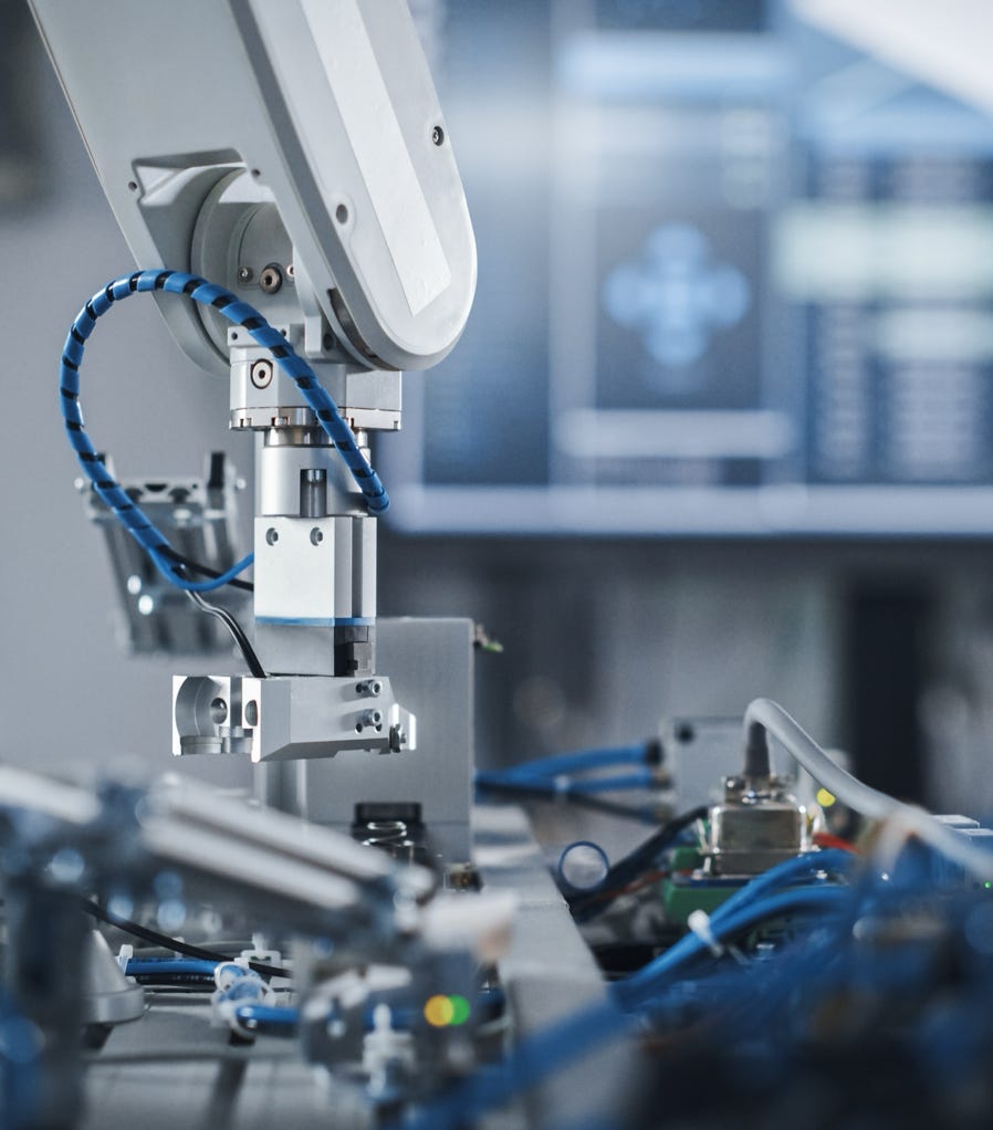 A man stands in front of a pottery shop